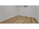 Basement room with light hardwood flooring and a small window at 1906 S Vrain St, Denver, CO 80219