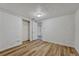 Basement bedroom with wood flooring, closet and access to the main living area at 1906 S Vrain St, Denver, CO 80219