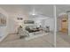 Finished basement with carpet flooring, recessed lights, and a gray sofa at 1906 S Vrain St, Denver, CO 80219