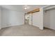 Basement room with carpet and an open layout featuring a view of the living area at 1906 S Vrain St, Denver, CO 80219
