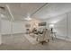 Finished basement with a sofa and chairs over carpet flooring at 1906 S Vrain St, Denver, CO 80219