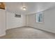 Empty basement room with neutral carpet flooring and natural light from the window at 1906 S Vrain St, Denver, CO 80219
