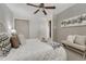 Tastefully decorated bedroom with neutral walls, plush bedding, carpet, and modern furnishings at 1906 S Vrain St, Denver, CO 80219