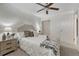 Neutral bedroom with carpet, a ceiling fan and a well-decorated bed plus a closet at 1906 S Vrain St, Denver, CO 80219