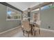 Cozy dining area featuring a stylish table with four chairs, complemented by unique wall art and shelving at 1906 S Vrain St, Denver, CO 80219