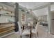 Dining space with seating for four, open to living room; features modern lighting and floating shelves at 1906 S Vrain St, Denver, CO 80219