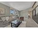 Cozy living room with neutral walls, plush carpet, and comfortable seating arrangement for relaxation at 1906 S Vrain St, Denver, CO 80219