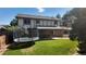 Lush backyard with a trampoline and covered patio, offers ample space for recreation and outdoor relaxation at 16639 E Berry Ln, Centennial, CO 80015