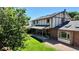 Expansive backyard features a covered patio, lush lawn, and mature landscaping, perfect for outdoor entertaining at 16639 E Berry Ln, Centennial, CO 80015