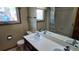 Well-lit bathroom featuring a double-sink vanity, large mirror, and combined shower and tub at 16639 E Berry Ln, Centennial, CO 80015