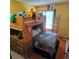 Bedroom with a bunk bed, drawers, and a window for natural light at 16639 E Berry Ln, Centennial, CO 80015