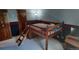 Unique bedroom with a lofted bed, wooden ladder, and dark accent wall, providing a cozy and private space at 16639 E Berry Ln, Centennial, CO 80015