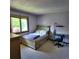 Bedroom with a bed, carpet flooring, and a window providing natural light at 16639 E Berry Ln, Centennial, CO 80015