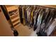 A walk-in closet boasts ample hanging space and built-in shelving for optimal storage and organization at 16639 E Berry Ln, Centennial, CO 80015