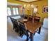 Dining room featuring a table with seating for eight and views into the kitchen and living room at 16639 E Berry Ln, Centennial, CO 80015