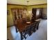 Traditional dining room with wood furniture, elegant chandelier, and built-in cabinets at 16639 E Berry Ln, Centennial, CO 80015