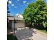 Spacious driveway leading to a two-car garage, framed by mature trees and a basketball hoop at 16639 E Berry Ln, Centennial, CO 80015