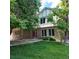 Charming two-story home with a well-maintained lawn and mature trees at 16639 E Berry Ln, Centennial, CO 80015