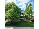 Charming home surrounded by mature trees and a well-maintained lawn, enhancing its curb appeal and creating a welcoming atmosphere at 16639 E Berry Ln, Centennial, CO 80015