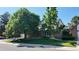 Charming two-story home with brick facade, well-maintained lawn, and mature trees, creating a welcoming curb appeal at 16639 E Berry Ln, Centennial, CO 80015