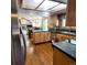 Functional kitchen design featuring dark countertops and light wood cabinets at 16639 E Berry Ln, Centennial, CO 80015