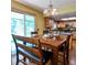 Kitchen nook with wood table, backyard access, and views to the kitchen at 16639 E Berry Ln, Centennial, CO 80015