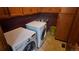 Laundry room includes washer, dryer, and utility sink with lots of cabinet storage at 16639 E Berry Ln, Centennial, CO 80015