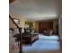 Cozy living room with plush seating, large window, and access to a dining space at 16639 E Berry Ln, Centennial, CO 80015