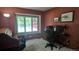 Office space with large window and view, complete with desk and rolltop secretary at 16639 E Berry Ln, Centennial, CO 80015