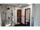 Modern shower features glass enclosure, marble accents, and sleek fixtures at 16639 E Berry Ln, Centennial, CO 80015