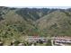 This is a top-down aerial of homes with landscaping and mountain views at 6835 Surrey Trl, Littleton, CO 80125