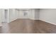 Spacious finished basement with beautiful hardwood floors and a window for natural light at 6835 Surrey Trl, Littleton, CO 80125