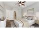 Relaxing bedroom with a queen size bed, art on the walls, and wood flooring at 6835 Surrey Trl, Littleton, CO 80125