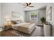 Serene bedroom with a plush bed, soft neutral tones, and a calming ambiance at 6835 Surrey Trl, Littleton, CO 80125