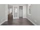 A bedroom boasts hardwood floors and ample closet space, illuminated by a window at 6835 Surrey Trl, Littleton, CO 80125