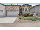 Charming home featuring stone accents, a two-car garage, and a welcoming front entrance at 6835 Surrey Trl, Littleton, CO 80125