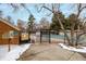 Fenced community pool area with a gate and bulletin board, offering residents a place to relax and socialize at 11861 E Yale Ct, Aurora, CO 80014