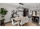 Modern dining room with stylish light fixture and contemporary design at 11861 E Yale Ct, Aurora, CO 80014