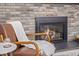 Cozy fireplace with brick surround and gas insert at 11861 E Yale Ct, Aurora, CO 80014