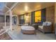 Inviting front porch features stylish seating and brick accents at 11861 E Yale Ct, Aurora, CO 80014