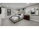 Serene main bedroom with neutral tones, plush carpet, and contemporary decor at 11861 E Yale Ct, Aurora, CO 80014