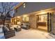 Spacious outdoor patio featuring comfortable seating with easy access to the interior through folding glass doors at 11861 E Yale Ct, Aurora, CO 80014