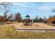 Community playground with slide, climbing structure, and soft sand flooring for hours of fun at 11861 E Yale Ct, Aurora, CO 80014