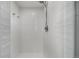 Contemporary shower with white subway tiles, sleek fixtures, and a minimalist design at 11861 E Yale Ct, Aurora, CO 80014