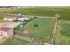 This is an aerial view of the property showing the fenced in paddock and outbuildings at 1851 E 138Th Ave, Brighton, CO 80602