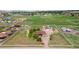 An aerial view of the property shows a home with a large lot and many outbuildings at 1851 E 138Th Ave, Brighton, CO 80602