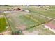 This aerial view showcases the property's open space, fencing, and shed at 1851 E 138Th Ave, Brighton, CO 80602
