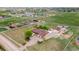 An aerial view of the property shows a home with a large lot, many outbuildings and a fenced boundary at 1851 E 138Th Ave, Brighton, CO 80602