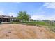 This home has an expansive backyard that features landscaping and garden beds at 1851 E 138Th Ave, Brighton, CO 80602