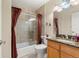 Bathroom featuring granite counters, wood cabinets, and a glass-enclosed shower at 1851 E 138Th Ave, Brighton, CO 80602